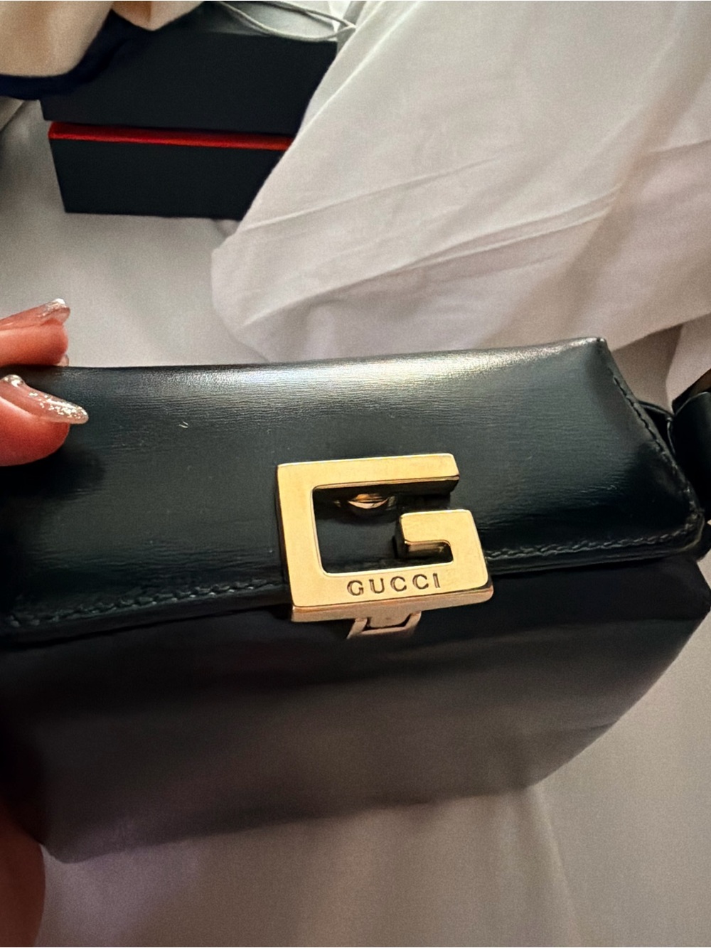 Gucci Black Leather Crossbody Bag with Gold G-Clasp